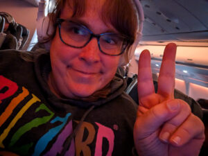 Kaedi on board an airplane about to leave the US